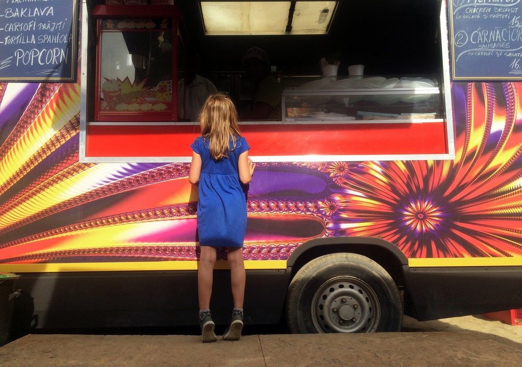 Girl in from of a food truck