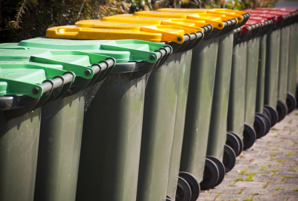 different colored trash bins lined up