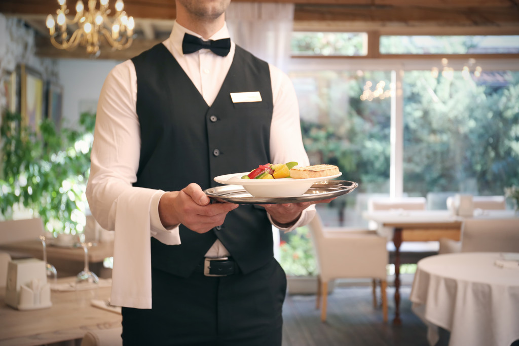 waiter serving food