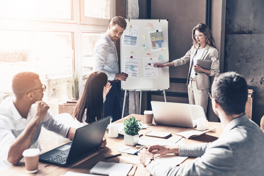 business presentation with man and woman presenting